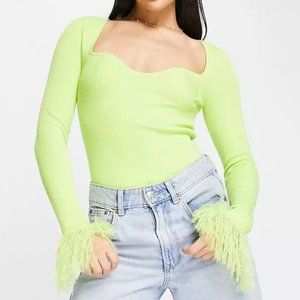 Knitted top with sweetheart neck and faux feather trims in lime yellow